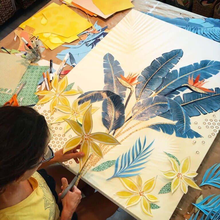 Jennifer reaching across a canvas mid-composition