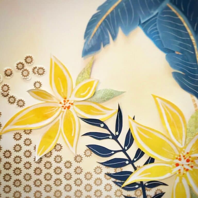 Yellow plumeria blooms taking shape over patterned paper